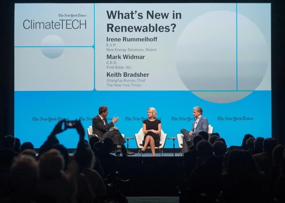 ClimateTECH speakers in a panel conversation in front of a seated audience