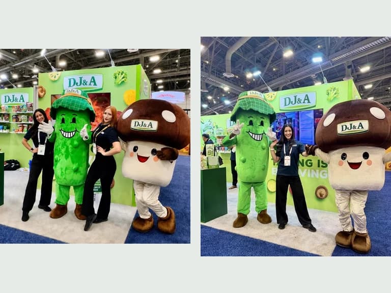 DJ&A mascots and staff at the Sweets and Snacks Expo booth