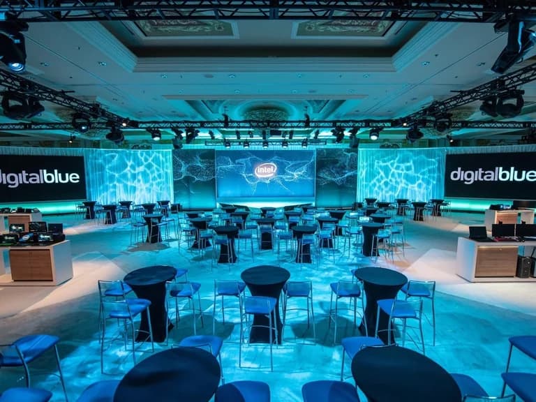 Intel CES retail experience room with illuminated displays and conversation tables