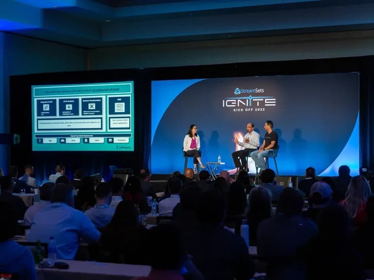 StreamSets Ignite presenters on stage in front of an audience