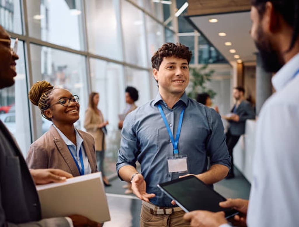 Professional event host welcoming attendees